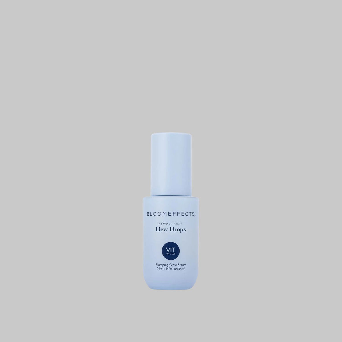 Bloomeffects Royal Tulip Dew Drops Plumping Glow Serum in a pale blue bottle on a gray background.