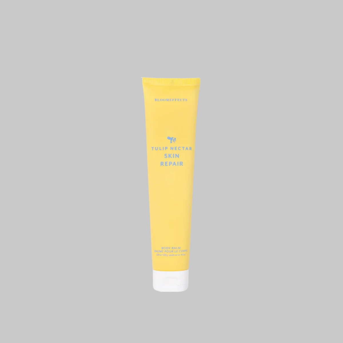 Bloomeffects Tulip Nectar Skin Repair Body Balm in a yellow tube with a white cap.
