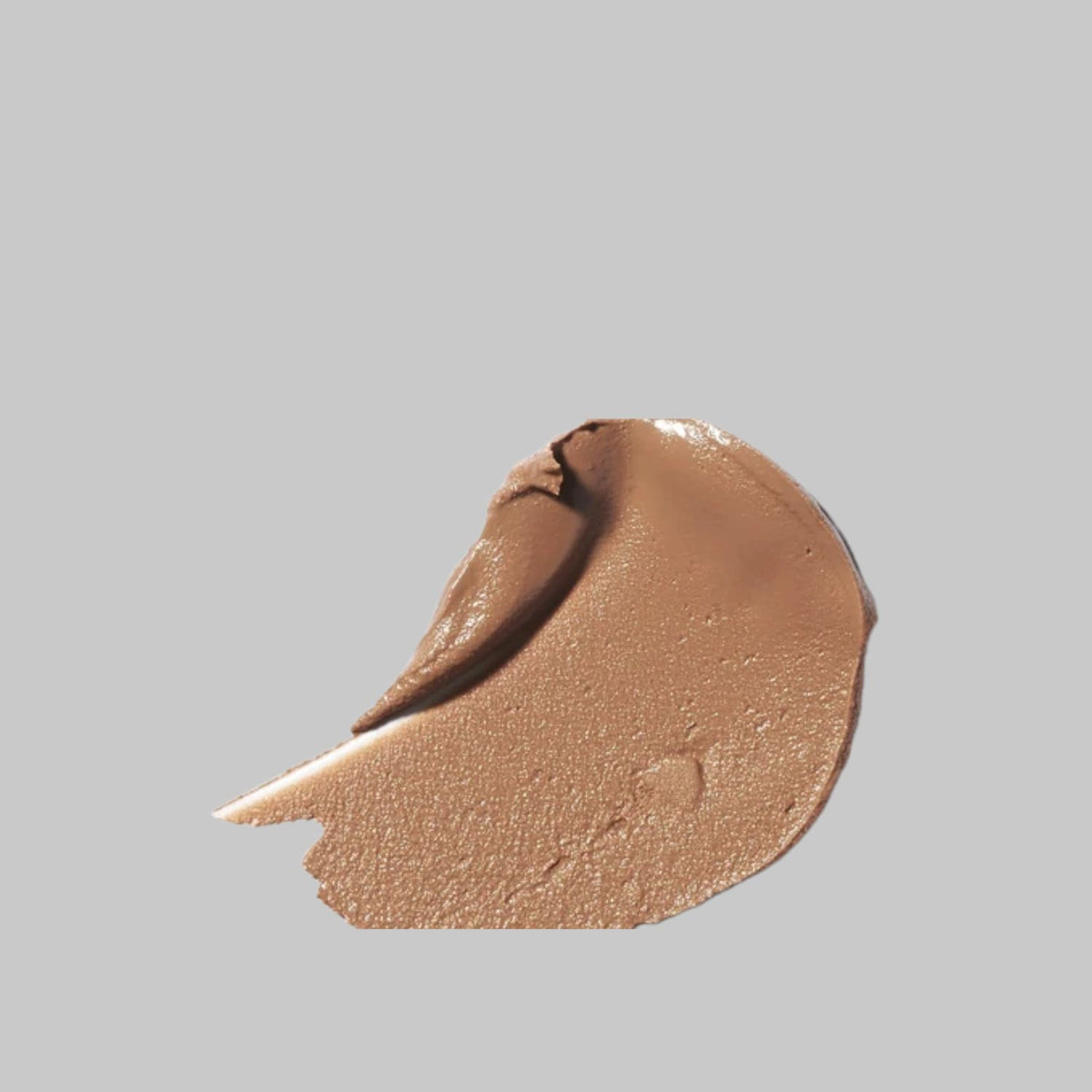 Golden-tan swatch of Ere Perez Cacao Bronzing Pot showing its creamy texture and subtle sheen